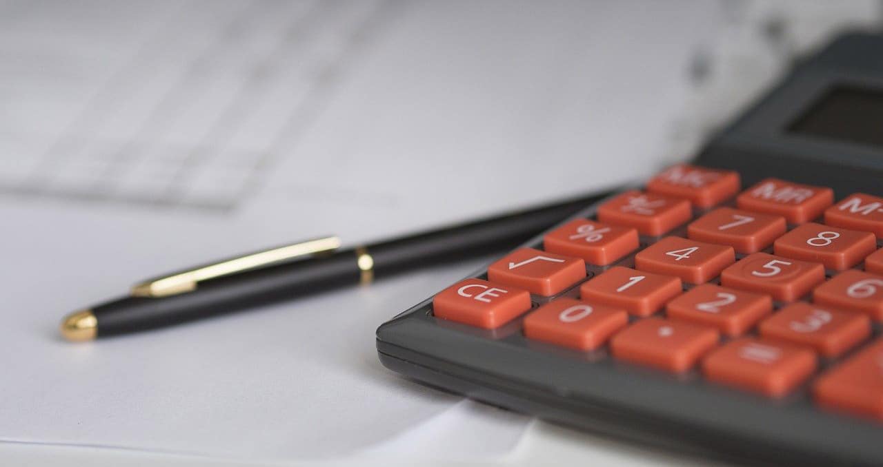 Fence Companies That Finance - Calculator and Ink Pen