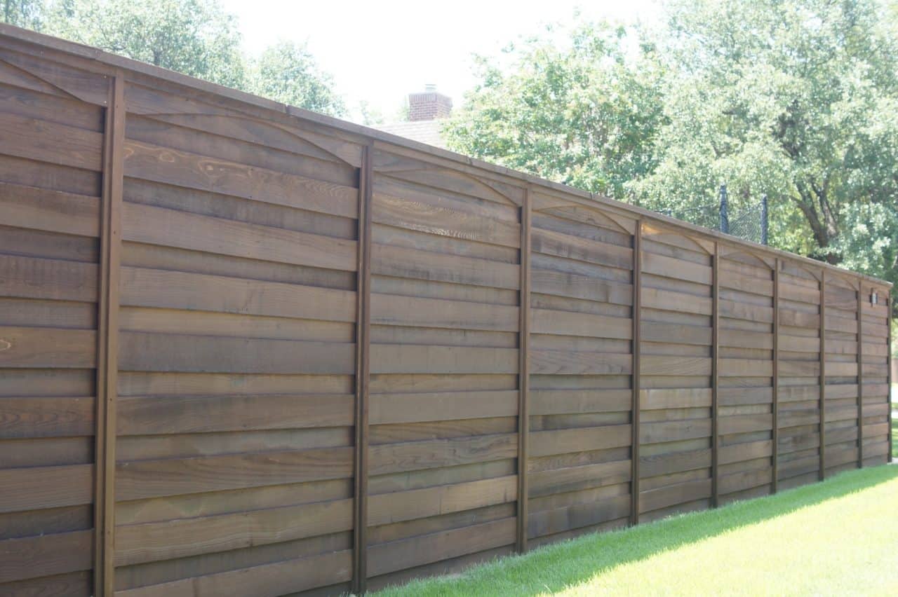 Spring Fence Company dark stained wood fence