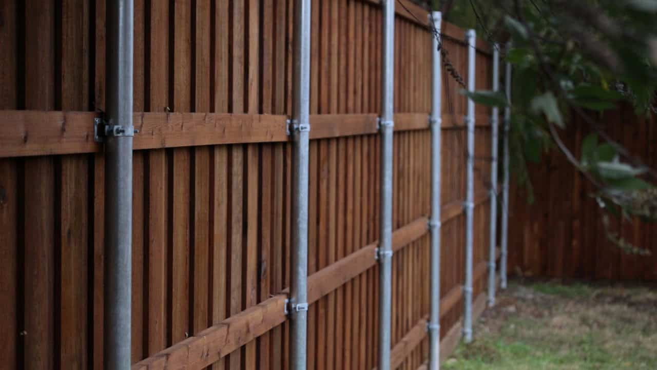 grand prairie fence builder dark stained wood privacy fence