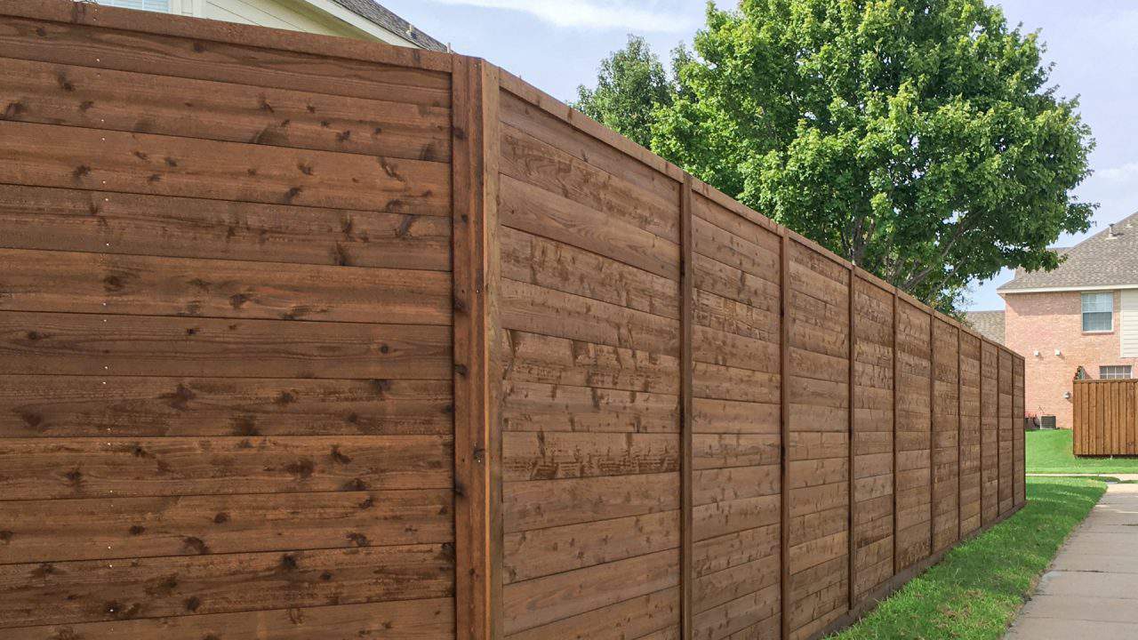 fence company Brookshire dark stained wood fence