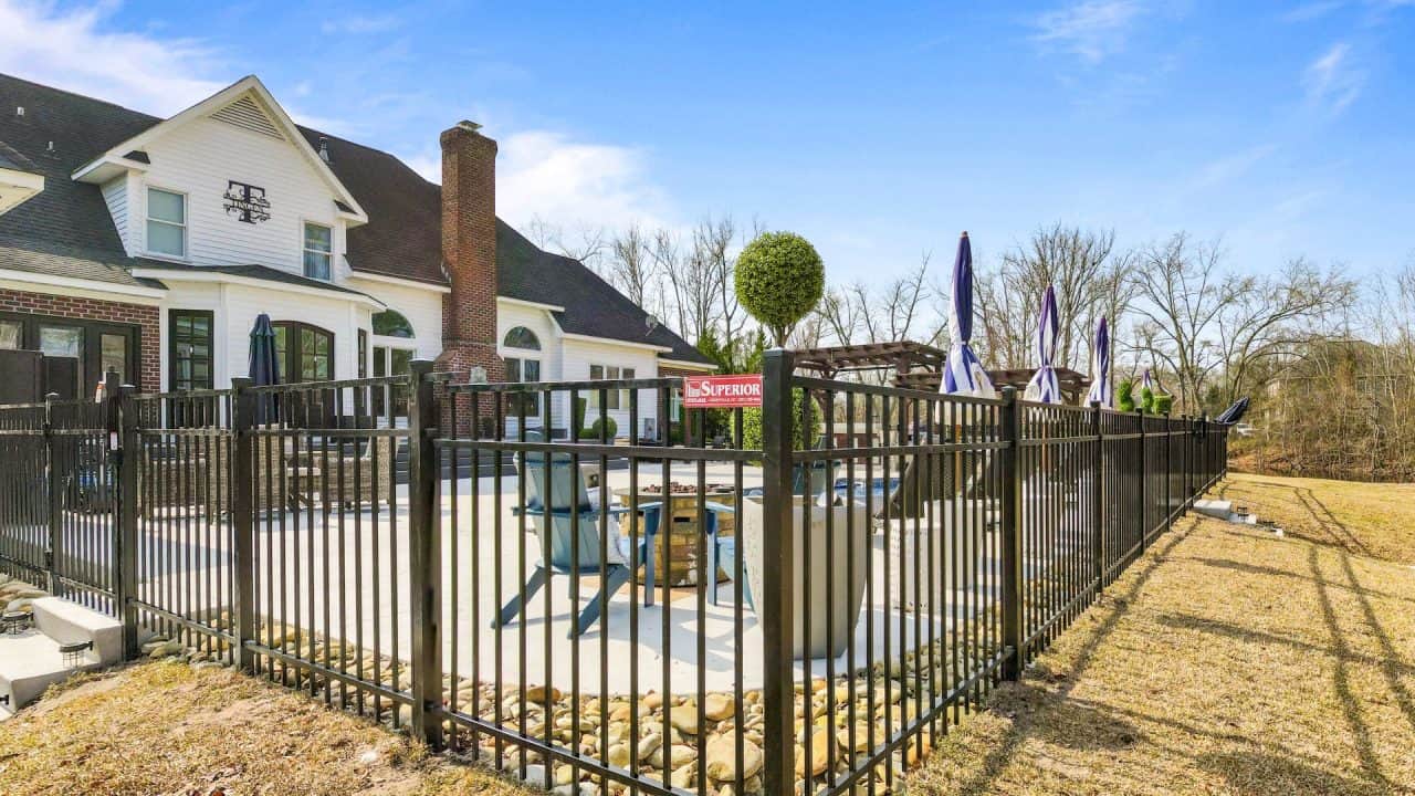 Black Fence In backyard with pool