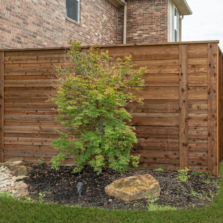 https://ded6429.inmotionhosting.com/~super126/wp-content/uploads/2025/01/wood-fence-designs-dark-stained-wood-fence.jpg