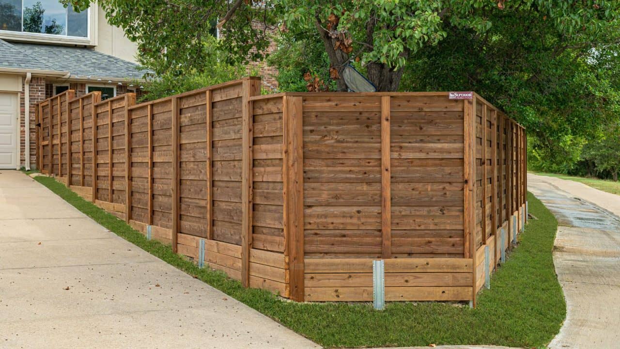 installing a horizontal fence on a sloped property